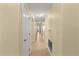 Bright and spacious hallway with tile flooring, connecting various rooms of the home at 3245 S Atlantic Ave # 208, Daytona Beach, FL 32118