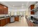Elegant kitchen showcases granite counters, stainless appliances, and seamless connection to the dining area at 3245 S Atlantic Ave # 208, Daytona Beach, FL 32118