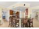 Modern kitchen with granite countertops, a breakfast bar with seating, and stainless steel appliances at 3245 S Atlantic Ave # 208, Daytona Beach, FL 32118