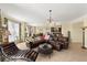 Bright living room features leather furniture, decorative lighting, and an open layout with access to the kitchen at 3245 S Atlantic Ave # 208, Daytona Beach, FL 32118