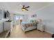 Serene main bedroom with balcony access, light blue walls, and a comfortable king-size bed at 3245 S Atlantic Ave # 208, Daytona Beach, FL 32118