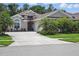Charming single-story home featuring lush landscaping and a welcoming front entrance at 3378 Leonardo Ln, New Smyrna Beach, FL 32168