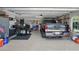 Well-organized garage featuring a truck, motorcycle, storage, and epoxy floors at 3378 Leonardo Ln, New Smyrna Beach, FL 32168