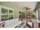Covered patio featuring comfortable outdoor seating, tiled floors, and a ceiling fan at 3378 Leonardo Ln, New Smyrna Beach, FL 32168
