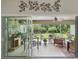 Bright sunroom featuring tile floors and sliding glass doors leading to the lush backyard at 3378 Leonardo Ln, New Smyrna Beach, FL 32168