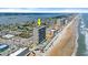 An aerial view showcasing the building's location with beach access and coastal views at 3425 S Atlantic Ave # 902, Daytona Beach, FL 32118