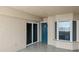 Private covered outdoor balcony with a tiled floor and glass sliding doors, perfect for enjoying the view at 3425 S Atlantic Ave # 902, Daytona Beach, FL 32118