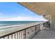 Oceanfront balcony with black railings overlooking the sandy beach and Atlantic ocean at 3425 S Atlantic Ave # 902, Daytona Beach, FL 32118