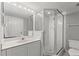 Bright bathroom with a vanity and mirror, and a shower with a glass door for a modern look at 3425 S Atlantic Ave # 902, Daytona Beach, FL 32118