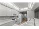 Bright white kitchen with ample storage and counter space, featuring modern appliances at 3425 S Atlantic Ave # 902, Daytona Beach, FL 32118
