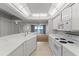 Bright kitchen features white cabinetry, countertops, and an open floorplan with ocean views at 3425 S Atlantic Ave # 902, Daytona Beach, FL 32118