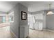 Kitchen area with white cabinets, modern appliances, tiled floor, and access to the dining area at 3425 S Atlantic Ave # 902, Daytona Beach, FL 32118