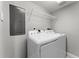 Laundry room area with appliances and shelving for convenient storage at 3425 S Atlantic Ave # 902, Daytona Beach, FL 32118