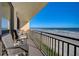 Relax on this condo balcony with comfortable seating and panoramic views of the ocean and the sandy beach at 4139 S Atlantic Ave # A302, New Smyrna Beach, FL 32169