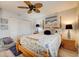 The bedroom has a ceiling fan, a bed, a closet, and plenty of room to relax and unwind after a long day at 4139 S Atlantic Ave # A302, New Smyrna Beach, FL 32169