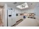 Bright, functional kitchen with updated white cabinetry, offering ample storage and counter space at 4139 S Atlantic Ave # A302, New Smyrna Beach, FL 32169