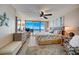 Spacious main bedroom with sliding glass doors to the balcony, allowing for stunning ocean views at 4139 S Atlantic Ave # A302, New Smyrna Beach, FL 32169