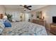 Inviting main bedroom with a comfortable bed, stylish décor, and ensuite bathroom access at 4139 S Atlantic Ave # A302, New Smyrna Beach, FL 32169