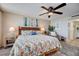 Serene main bedroom featuring beach-themed decor, plush bedding, and a relaxing atmosphere at 4139 S Atlantic Ave # A302, New Smyrna Beach, FL 32169