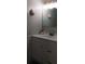 Clean bathroom with a vanity, sink, and minimalist decor, providing a functional and tidy space at 4175 S Atlantic Ave # 2280, New Smyrna Beach, FL 32169