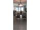 A dining area with tile floors, ceiling fan, chairs and table and seating, located near the living room at 4175 S Atlantic Ave # 2280, New Smyrna Beach, FL 32169