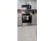 Bright kitchen featuring modern appliances, including a stainless steel oven and microwave at 4175 S Atlantic Ave # 2280, New Smyrna Beach, FL 32169