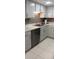 Clean kitchen with white cabinets, stainless steel appliances, and subway tile backsplash at 4175 S Atlantic Ave # 2280, New Smyrna Beach, FL 32169