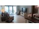 Bright living room featuring tile floors, ceiling fan and comfortable seating arrangements at 4175 S Atlantic Ave # 2280, New Smyrna Beach, FL 32169