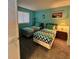 Bedroom featuring twin beds, bright walls and bedside table at 421 S Atlantic Ave # 407, New Smyrna Beach, FL 32169