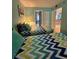 Bedroom with two beds and bright lighting and an open doorway at 421 S Atlantic Ave # 407, New Smyrna Beach, FL 32169