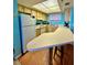 Functional kitchen featuring bright cabinetry, ample counter space, and breakfast bar at 421 S Atlantic Ave # 407, New Smyrna Beach, FL 32169