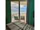 Bedroom with sliding glass doors opens to gorgeous ocean view and beach access at 421 S Atlantic Ave # 407, New Smyrna Beach, FL 32169