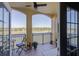 Relaxing balcony featuring great lake views, seating and access from interior at 424 Luna Bella Ln # 316, New Smyrna Beach, FL 32168