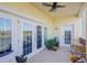 A cozy balcony with tile flooring, outdoor seating and views of the community at 424 Luna Bella Ln # 316, New Smyrna Beach, FL 32168
