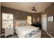 Cozy bedroom with a ceiling fan, two windows, and stylish furnishings at 424 Luna Bella Ln # 316, New Smyrna Beach, FL 32168