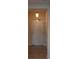 Entryway featuring a sturdy white front door with tile flooring and a decorative hanging light fixture at 424 Luna Bella Ln # 316, New Smyrna Beach, FL 32168
