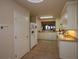 Well-lit kitchen with white cabinetry, tile flooring, and modern appliances at 424 Luna Bella Ln # 316, New Smyrna Beach, FL 32168