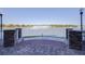 Stunning lake view with brick pavers and a fountain for a serene outdoor experience at 424 Luna Bella Ln # 316, New Smyrna Beach, FL 32168