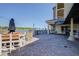 Inviting outdoor patio with lake views, cafe, and Bistro 424 at 424 Luna Bella Ln # 316, New Smyrna Beach, FL 32168