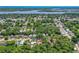 Aerial view of a home nestled among trees, showcasing its location within a vibrant neighborhood at 428 Perdita Ave, Edgewater, FL 32132