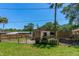 Fenced backyard featuring a shed, grill, and ample space for outdoor activities and storage at 428 Perdita Ave, Edgewater, FL 32132