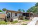 Backyard featuring a screened porch, shed, fence, and greenery, creating a private outdoor space at 428 Perdita Ave, Edgewater, FL 32132