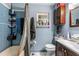 Blue tiled bathroom featuring a shower, toilet, sink and vanity at 428 Perdita Ave, Edgewater, FL 32132