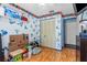 Bedroom featuring blue patterned wallpaper, built-in shelves, and closet at 428 Perdita Ave, Edgewater, FL 32132