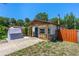 Charming single-story home featuring stone accents and a blue front door at 428 Perdita Ave, Edgewater, FL 32132