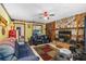 Cozy living room with a stone fireplace and wood-paneled accent wall at 428 Perdita Ave, Edgewater, FL 32132