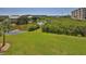 Lush backyard with a pond view, showcasing the natural surroundings at 4620 Riverwalk Village Ct # 7306, Ponce Inlet, FL 32127