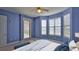 Bedroom with bay window, ceiling fan, and private exterior door at 4620 Riverwalk Village Ct # 7306, Ponce Inlet, FL 32127