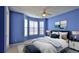 Comfortable bedroom featuring a bay window, ceiling fan and stylish decor at 4620 Riverwalk Village Ct # 7306, Ponce Inlet, FL 32127