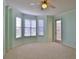 Bedroom with large windows and a door to the outside at 4620 Riverwalk Village Ct # 7306, Ponce Inlet, FL 32127